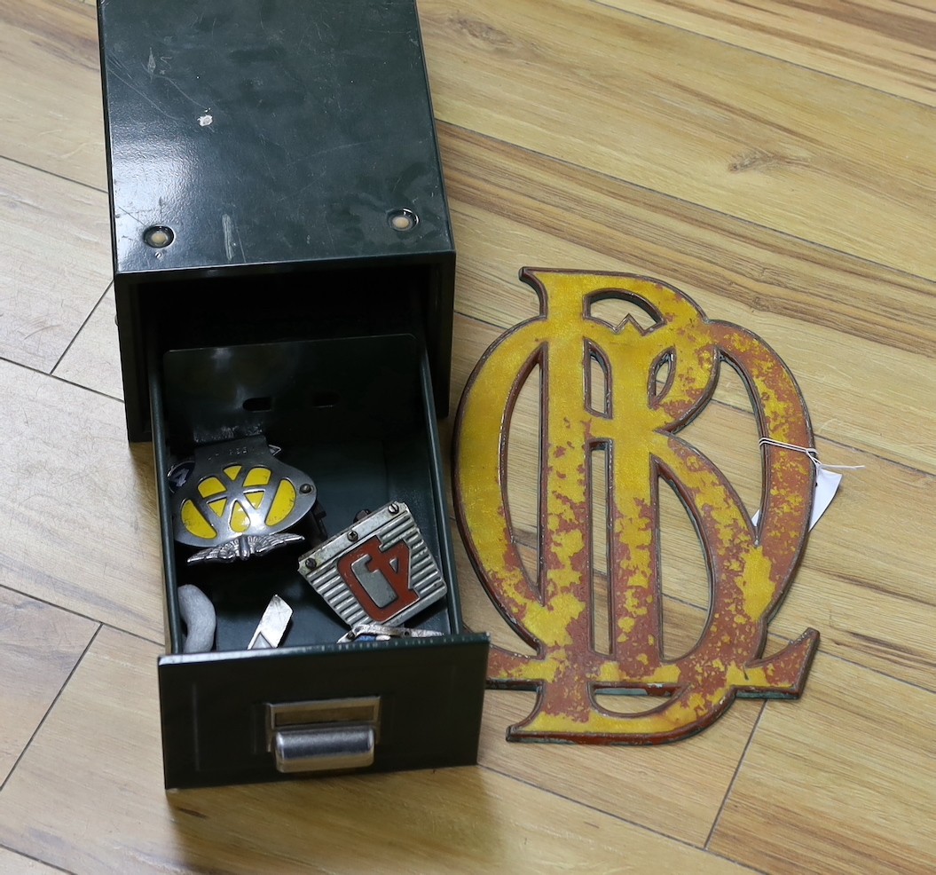 An selection of assorted car badges